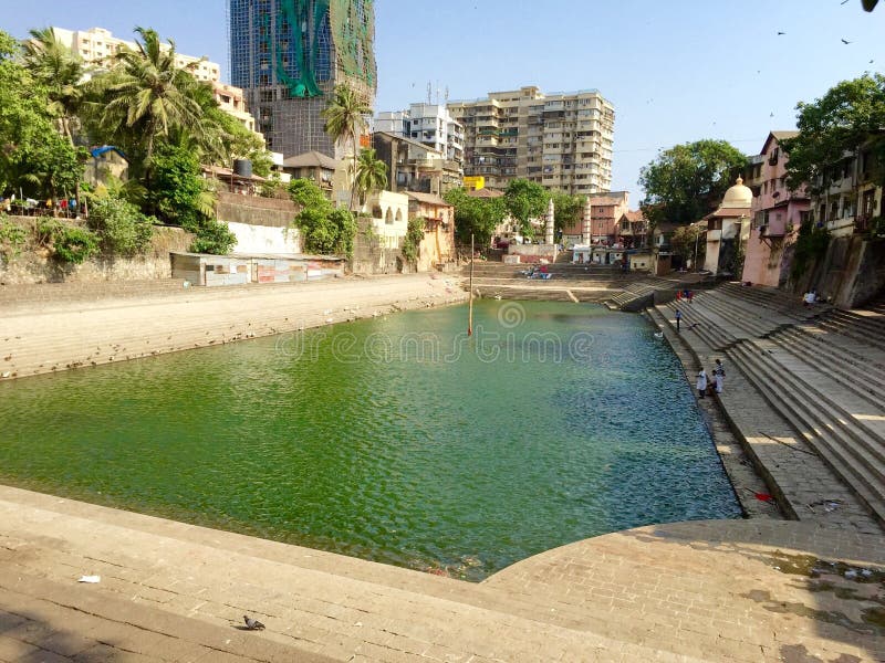 Banganga or Banganga Tank is an ancient water tank which is part of the Walkeshwar Temple Complex in Malabar Hill area of Mumbai in India. The Tank was built in the 1127 AD, by Lakshman Prabhu, a minister in the court of Silhara dynasty kings of Thane. According to local legend, it sprang forth when the Lord Ram, the exiled hero of the epic Ramayana, stopped at the spot in search of his kidnapped wife Sita. The tank today is a rectangular pool structure surrounded by steps on all four sides. At the entrance are two pillars in which oil lamps called diyas were lit in ancient times. Banganga or Banganga Tank is an ancient water tank which is part of the Walkeshwar Temple Complex in Malabar Hill area of Mumbai in India. The Tank was built in the 1127 AD, by Lakshman Prabhu, a minister in the court of Silhara dynasty kings of Thane. According to local legend, it sprang forth when the Lord Ram, the exiled hero of the epic Ramayana, stopped at the spot in search of his kidnapped wife Sita. The tank today is a rectangular pool structure surrounded by steps on all four sides. At the entrance are two pillars in which oil lamps called diyas were lit in ancient times.