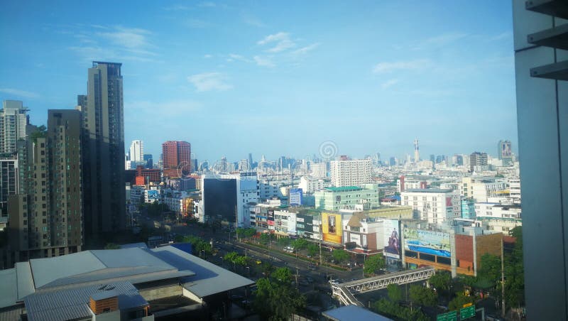 Bangkok city skyline in Thailand with apartments and office buildings. View, road, skyscrapers, capital, daytine, daytime, sunny, blue royalty free stock image Bangkok city skyline in Thailand with apartments and office buildings. View, road, skyscrapers, capital, daytine, daytime, sunny, blue royalty free stock image