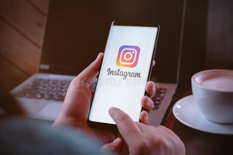 Bangkok, Thailand - August 5, 2019: A women holds a smartphone with instragram logo on the screen. Instagram is largest and most royalty free stock photo Bangkok, Thailand - August 5, 2019: A women holds a smartphone with instragram logo on the screen. Instagram is largest and most royalty free stock photo