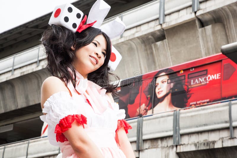 A young beautiful thai girl posing for a photographer during a cosplay festival in front of Siam Pagagon, Bangkok