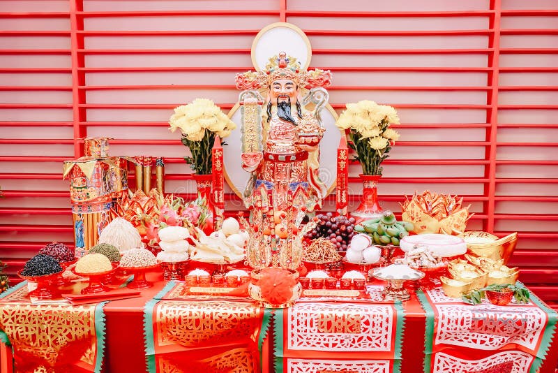 Cai Shen God of Wealth Goddess of Fortune and Food on the table for gods worshiping Chinese beliefs in the Chinese new year