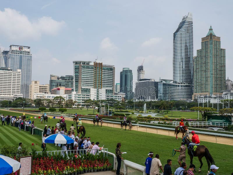 Bangkok, Thailand - Feb 24, 2019: jockey take the horse to warm up the body before the race at The Royal Bangkok Sports Club stock photography Bangkok, Thailand - Feb 24, 2019: jockey take the horse to warm up the body before the race at The Royal Bangkok Sports Club stock photography