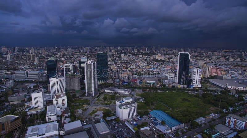 BANGKOK THAILAND - JUNE 7,2017 : aerial view of high and modern office building at ratchadaphisek road and rainstroming cloud background