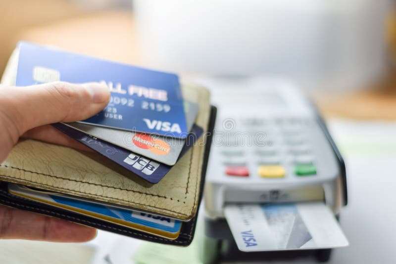 Bangkok, Thailand - March 3, 2019: Group of credit cards on Credit Card Machine with VISA ,Master Card and JCB brand