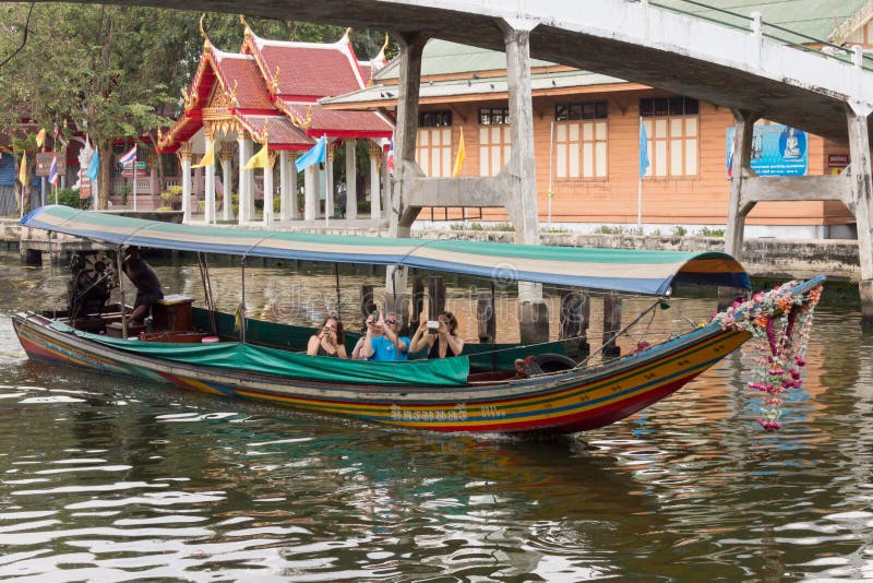 Tourists taking photographs from a boat. royalty free stock images Tourists taking photographs from a boat. royalty free stock images