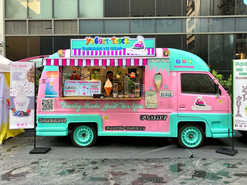 Customer Eating Meals from a Food Truck at Siam Square One in Bangkok