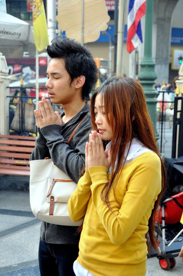 Bangkok, Thailand: Praying Couple At Erawan Shrine