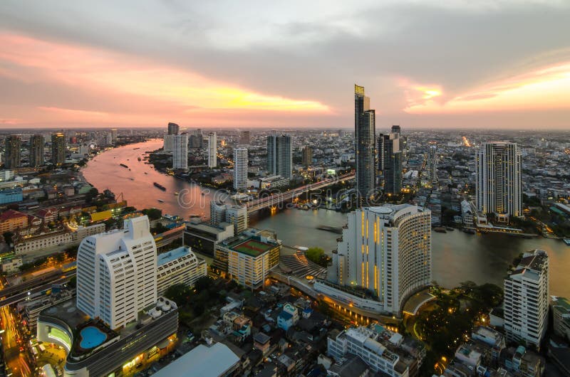 Bangkok Transportation at Dusk with Modern Business Building along the river (Thailand)