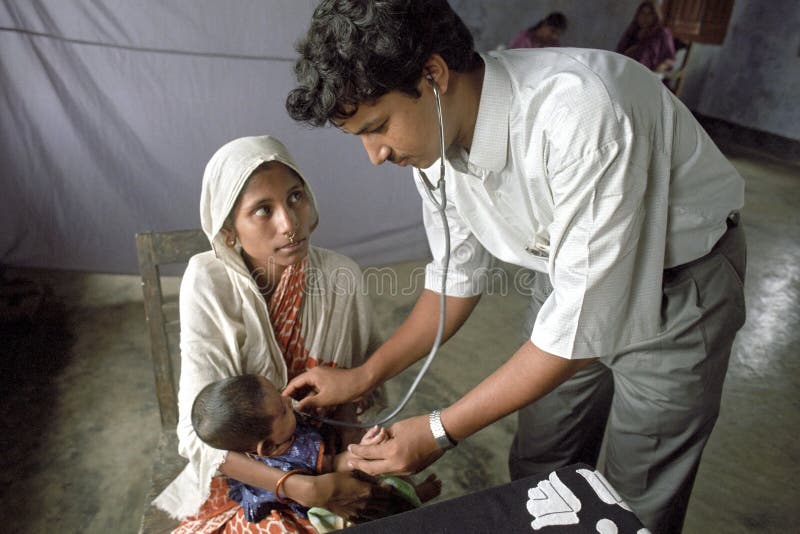 Bangladeshi doctor examining young child