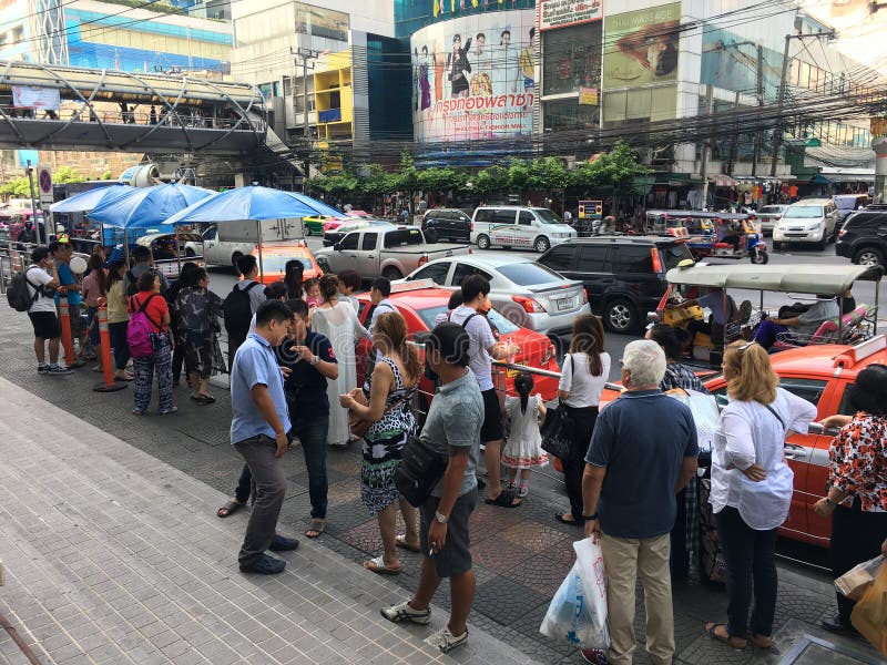 BANGKOK - MARCH 17, 2016 : Unidentified People Stand In Queue To Get To A  Louis Vuitton Store In The Siam Paragon Shopping Mall. For Years 2006–2012  LV Was Named The Worlds