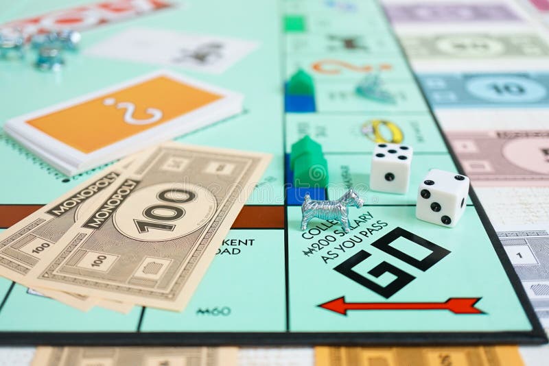 Bangkok, Thailand - Feb 11, 2019 : A monopoly board game with selective focus on the dog player. West Highland White Terrier dog stock image Bangkok, Thailand - Feb 11, 2019 : A monopoly board game with selective focus on the dog player. West Highland White Terrier dog stock image