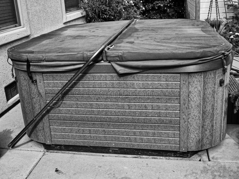 Worn out old hot tub ready to be hauled away and replaced by a newer model. Worn out old hot tub ready to be hauled away and replaced by a newer model.