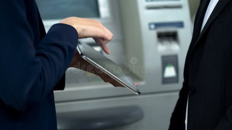 Bank assistant helping client to book railway tickets using tablet, bill payment royalty free stock photos Bank assistant helping client to book railway tickets using tablet, bill payment royalty free stock photos