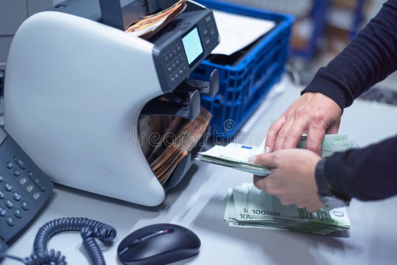 Bank Employees Sorting and Counting Money Inside Bank Vault. Large