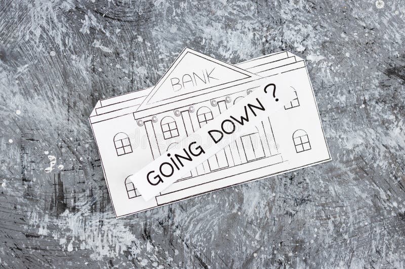 Insolvency and banks closing down concept, bank made of paper with Going Down ? caption above it stock photography Insolvency and banks closing down concept, bank made of paper with Going Down ? caption above it stock photography