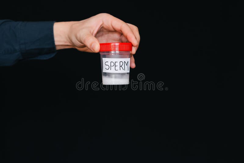 Bank of sperm in a male donor hand for analysis stock photo Bank of sperm in a male donor hand for analysis stock photo