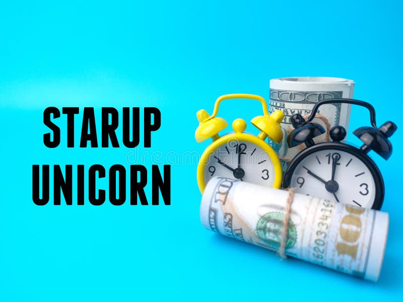 Banknotes and clock with text STARUP UNICORN