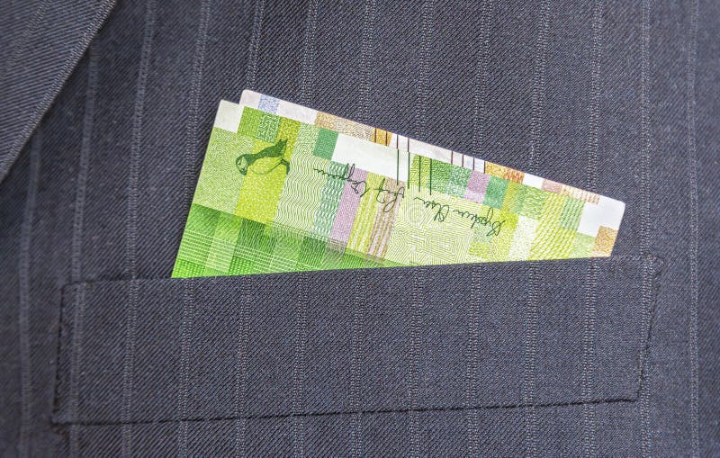 Banknotes of Norwegian Krones Sticking Out of the Coat Pocket Stock
