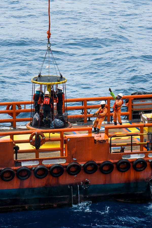 The Personnel Basket Dropping Down To Crew Boat Deck Stock 