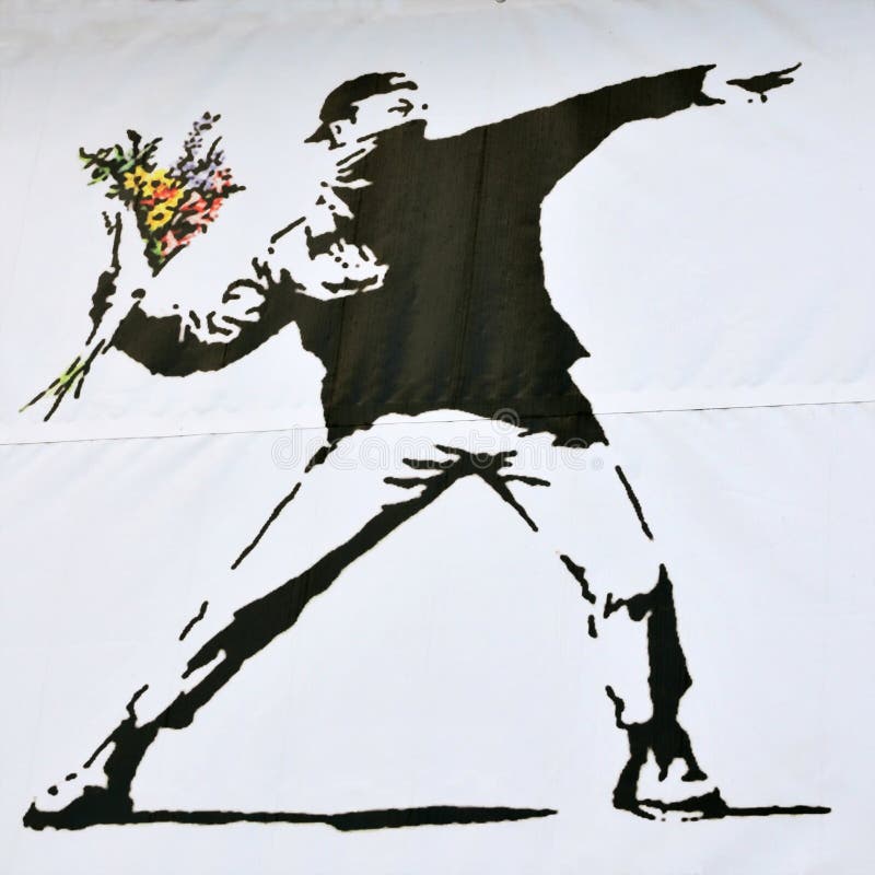 BRISTOL - SEPTEMBER 26: Banksy stencil piece of a rioter throwing a flower bouquet on a wall in the city centre on September 26, 2010 in Bristol, UK. Banksy is a renowned graffiti artist from Bristol. BRISTOL - SEPTEMBER 26: Banksy stencil piece of a rioter throwing a flower bouquet on a wall in the city centre on September 26, 2010 in Bristol, UK. Banksy is a renowned graffiti artist from Bristol.