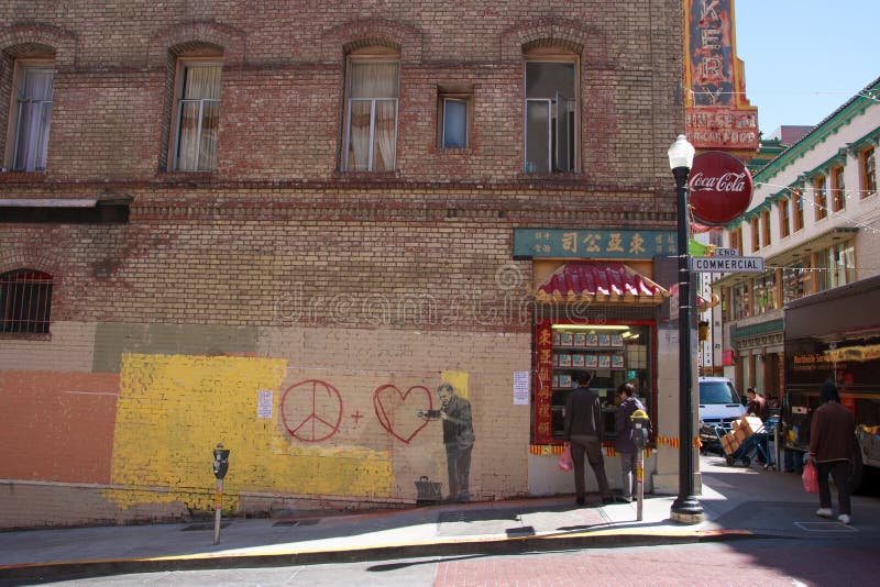 SAN FRANCISCO, CA - CIRCA MAY 2010: Stencil graffiti piece by Banksy on a building in Chinatown, circa May 2010 in San Francisco, CA. SAN FRANCISCO, CA - CIRCA MAY 2010: Stencil graffiti piece by Banksy on a building in Chinatown, circa May 2010 in San Francisco, CA