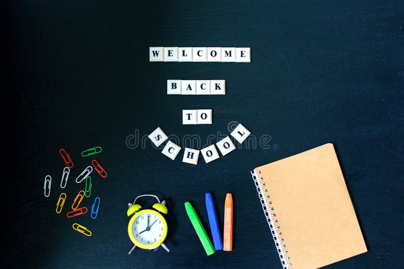 Banner Concept. Welcome back to School on black blackboard background. Top View. Flat Lay. Design. Copy Space Supplies. stock photos Banner Concept. Welcome back to School on black blackboard background. Top View. Flat Lay. Design. Copy Space Supplies. stock photos