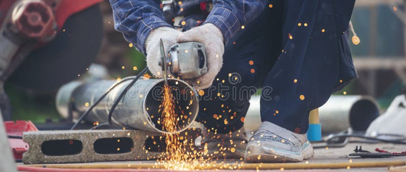 Banner Men hands wear protective glove Hot flame metal work cut fire iron workshop. Locksmith cut metal process. Construction stock images