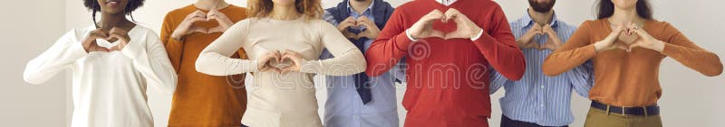 Group of thankful youth and senior citizens showing love and support and sending gratitude. Banner with midsection shot of young and mature people doing heart shape hand gesture. Group of thankful youth and senior citizens showing love and support and sending gratitude. Banner with midsection shot of young and mature people doing heart shape hand gesture