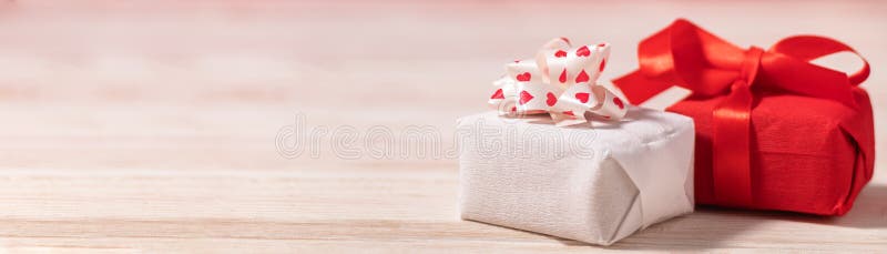 Banner with two gift boxes on the table with copy space for valentine&#x27;s day celebration. Holiday, love and dating concept.