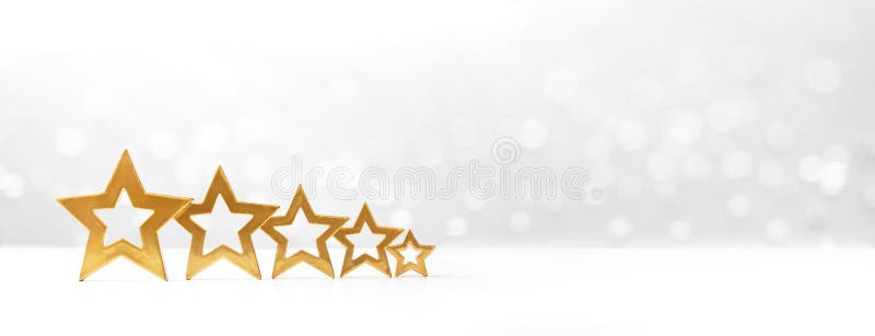 Five golden shining stars on white background with sparkling lights, copy space, banner format. Five golden shining stars on white background with sparkling lights, copy space, banner format