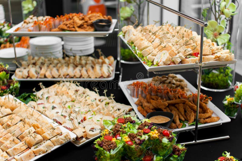 Banquet table for guests with starters and snacks