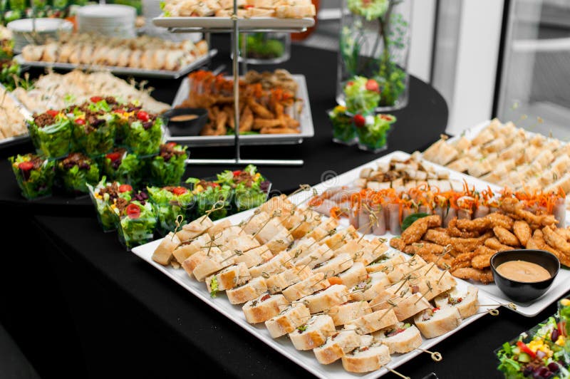 Banquet table for guests with starters and snacks
