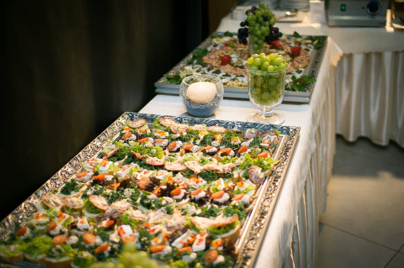 Banquet table for guests with starters and snacks