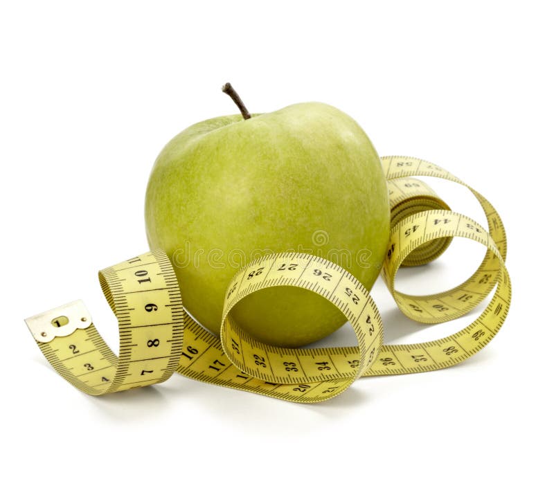 Close up of measure tape and green apple on white background with clipping path. Close up of measure tape and green apple on white background with clipping path