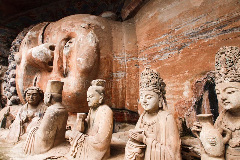 The Dazu Rock Carvings (Chinese: 大足石刻; pinyin: Dàzú Shíkè) are a series of Chinese religious sculptures and carvings, dating back as far as the 7th century AD, depicting and influenced by Buddhist, Confucian and Taoist beliefs. Listed as a World Heritage Site, the Dazu Rock Carvings are made up of 75 protected sites containing some 50,000 statues, with over 100,000 Chinese characters forming inscriptions and epigraphs. The sites are located in Chongqing Municipality within the steep hillsides throughout Dazu County, located about 60 kilometers west of the urban area of Chongqing. The highlights of the rock grotto are found on Mount Baoding and Mount Beishan. The Dazu Rock Carvings (Chinese: 大足石刻; pinyin: Dàzú Shíkè) are a series of Chinese religious sculptures and carvings, dating back as far as the 7th century AD, depicting and influenced by Buddhist, Confucian and Taoist beliefs. Listed as a World Heritage Site, the Dazu Rock Carvings are made up of 75 protected sites containing some 50,000 statues, with over 100,000 Chinese characters forming inscriptions and epigraphs. The sites are located in Chongqing Municipality within the steep hillsides throughout Dazu County, located about 60 kilometers west of the urban area of Chongqing. The highlights of the rock grotto are found on Mount Baoding and Mount Beishan.