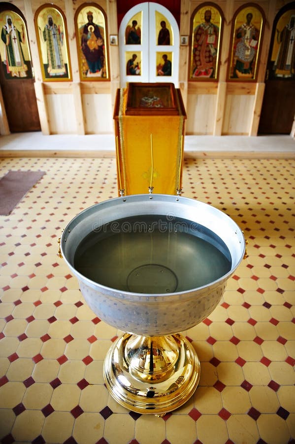 Baptismal font near altar in Christian church