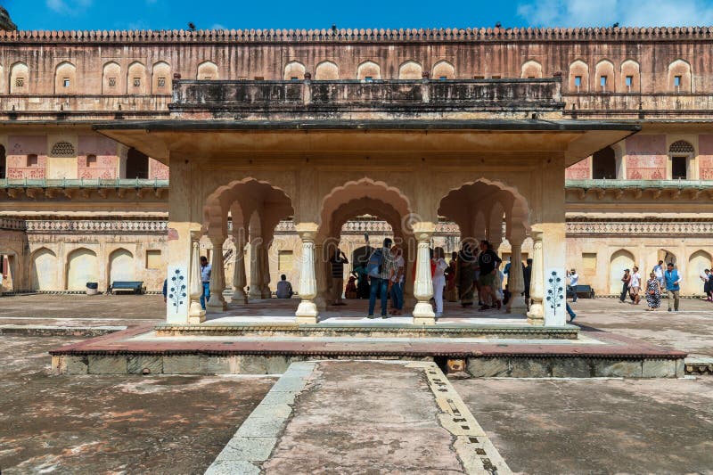 Baradari Pavilion in the Amber, Fort Amer , Rajasthan, India. Ornate gateway to the vast Amber Palace complex, with a painting of the Hindu elephant deity Ganesh.A narrow 4WD road leads up to the entrance gate, known as the Suraj Pol (Sun Gate) of the fort. It is now considered much more ethical for tourists to take jeep rides up to the fort, instead of riding the elephants. Amer Fort or Amber Fort is a fort located in Amer, Rajasthan, India. Amer is a town with an area of 4 square kilometres (1.5 sq mi) located 11 kilometres (6.8 mi) from Jaipur, the capital of Rajasthan. Located high on a hill, it is the principal tourist attraction in Jaipur. Amer Fort is known for its artistic style elements. With its large ramparts and series of gates and cobbled paths, the fort overlooks Maota Lake which is the main source of water for the Amer Palace. Baradari Pavilion in the Amber, Fort Amer , Rajasthan, India. Ornate gateway to the vast Amber Palace complex, with a painting of the Hindu elephant deity Ganesh.A narrow 4WD road leads up to the entrance gate, known as the Suraj Pol (Sun Gate) of the fort. It is now considered much more ethical for tourists to take jeep rides up to the fort, instead of riding the elephants. Amer Fort or Amber Fort is a fort located in Amer, Rajasthan, India. Amer is a town with an area of 4 square kilometres (1.5 sq mi) located 11 kilometres (6.8 mi) from Jaipur, the capital of Rajasthan. Located high on a hill, it is the principal tourist attraction in Jaipur. Amer Fort is known for its artistic style elements. With its large ramparts and series of gates and cobbled paths, the fort overlooks Maota Lake which is the main source of water for the Amer Palace.