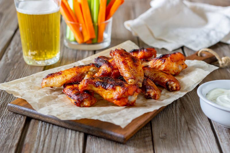 Barbecue Chicken Wings with Carrots, Celery and White Sauce. Grill ...