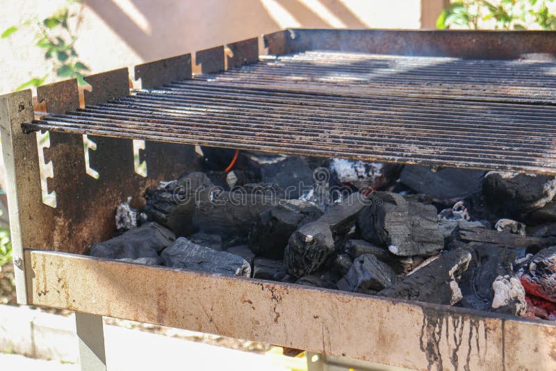 Grill Getting Hot for Cooking Food Outside. Fire Flames Burning in Bbq