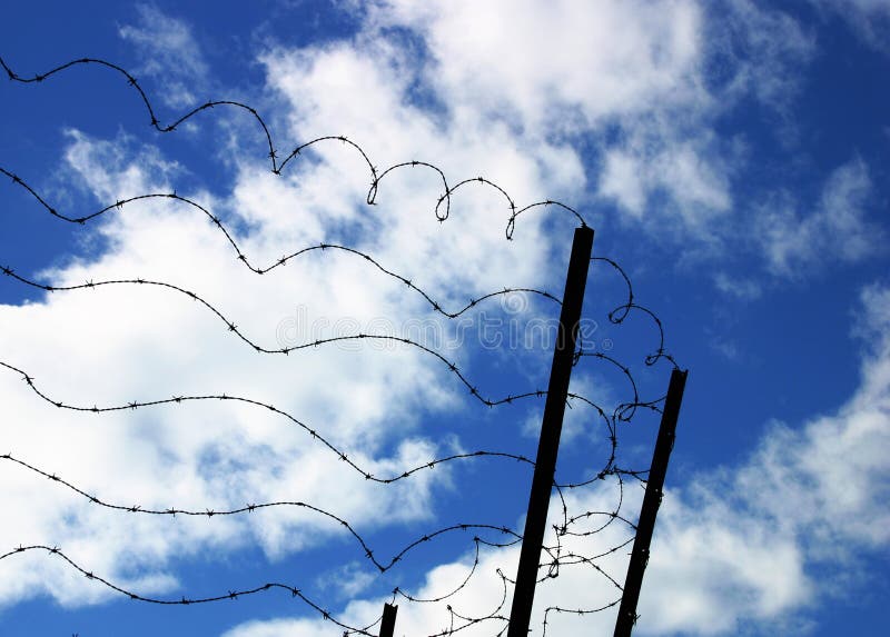 Barbed wire on blue sky