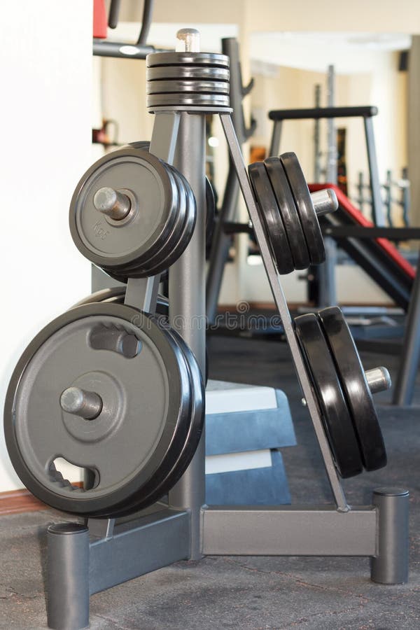Barbell plates in the gym stock image. Image of powerlifting 49979819