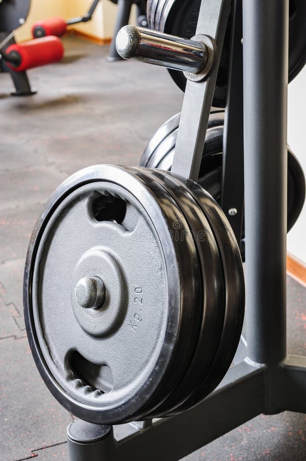 Barbell plates rack stock image. Image of fitness, gymnasium 37703749