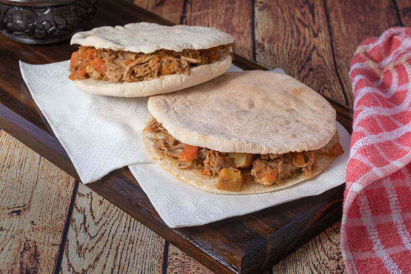 Barbeque Pulled Pork Sandwich with BBQ Sauce on Pita Bread and Fries