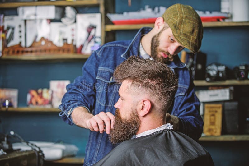 Barber Busy with Grooming Beard of Hipster Client, Beauty Supplies on  Background. Hipster with Beard Covered with Cape Stock Photo - Image of  grooming, macho: 139827066