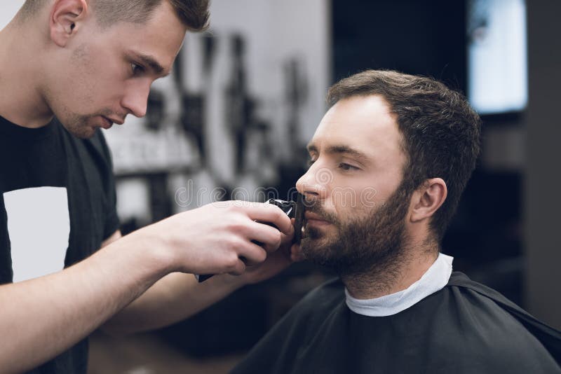 Barber is Cutting a Beard To a Man in a Hair Salon. Stock Image - Image of happy, mustache: 104208821 Barber is Cutting a Beard To a Man in a Hair Salon. Stock Image - Image of happy, mustache: 104208821
