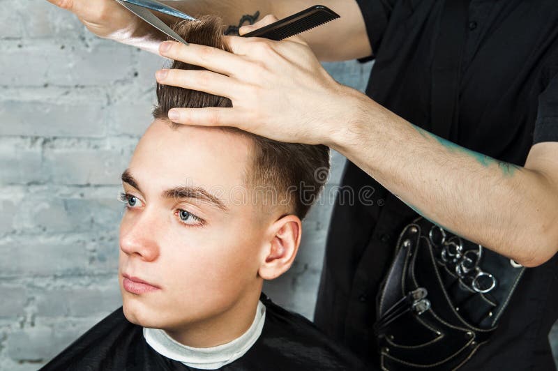 Barber Hair Styling of Young Guy in the Barbershop on Brick Wall Background, Hairdresser Makes Hairstyle for a Young Man. Stock Image - Image of barbershop, clippers: 146852679 Barber Hair Styling of Young Guy in the Barbershop on Brick Wall Background, Hairdresser Makes Hairstyle for a Young Man. Stock Image - Image of barbershop, clippers: 146852679