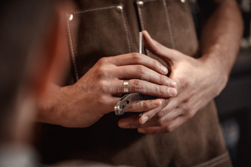 Barber hand and blade stock image. Image of apron, knife 118304973