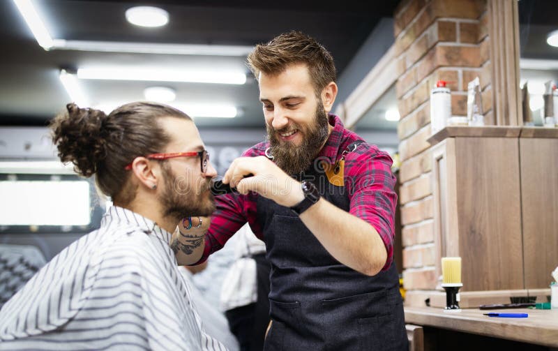 Barber Shaving a Bearded Man in a Barber Shop, Close-up Stock Photo ...