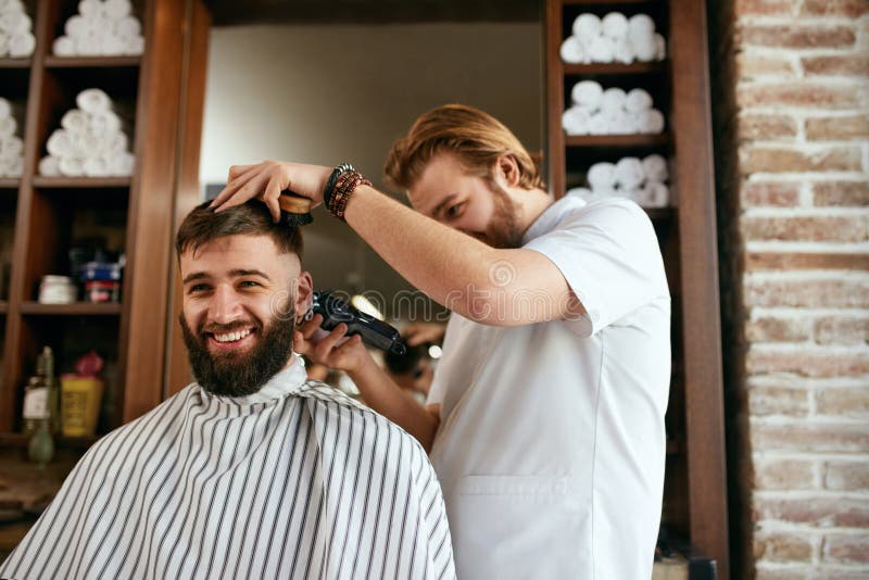 Men Haircut. Barber Cutting Man`s Hair in Barber Shop Stock Photo ...