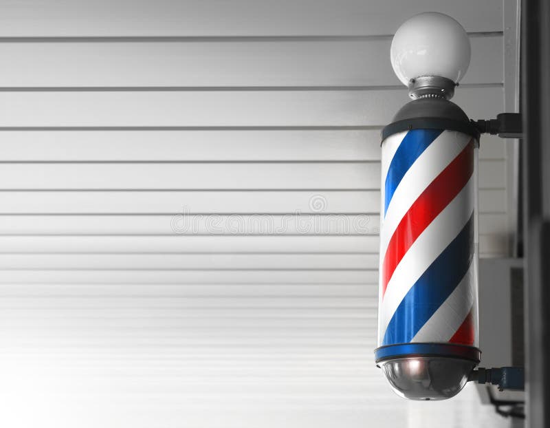 Old fashioned vintage barber shop pole against modern background. Old fashioned vintage barber shop pole against modern background